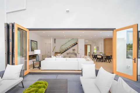 a kitchen with stainless steel appliances granite countertop a stove a refrigerator and a microwave