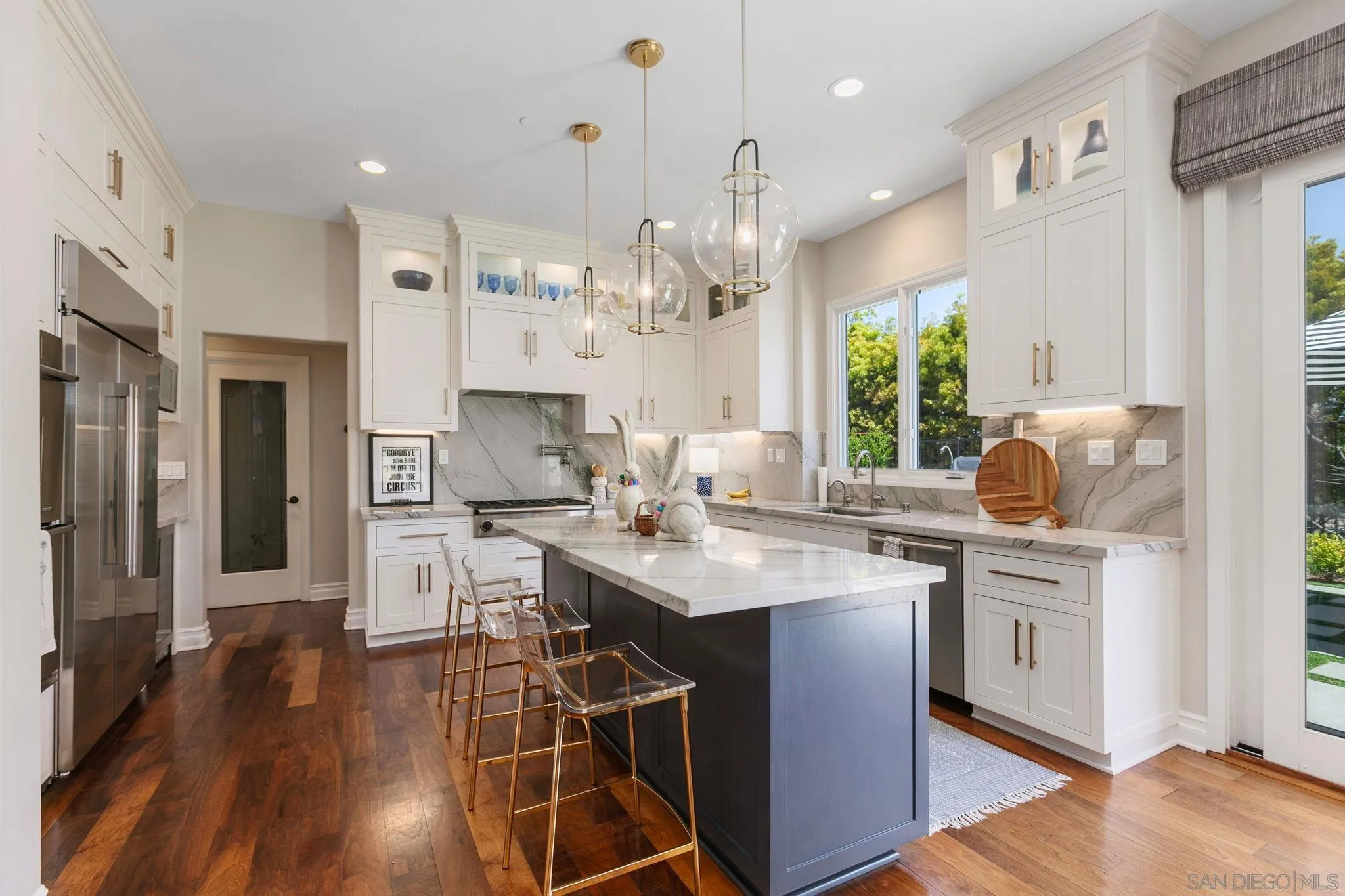 329 Chopin Way Cardiff, CA 92007 - Photo 15 of 47 a kitchen with stainless steel appliances a sink stove and refrigerator