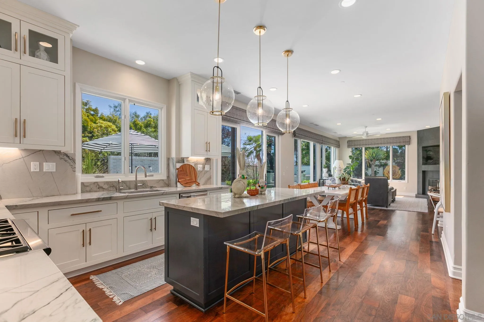 329 Chopin Way Cardiff, CA 92007 - Photo 16 of 47 a view of a kitchen with kitchen island granite countertop a large window and stainless steel appliances