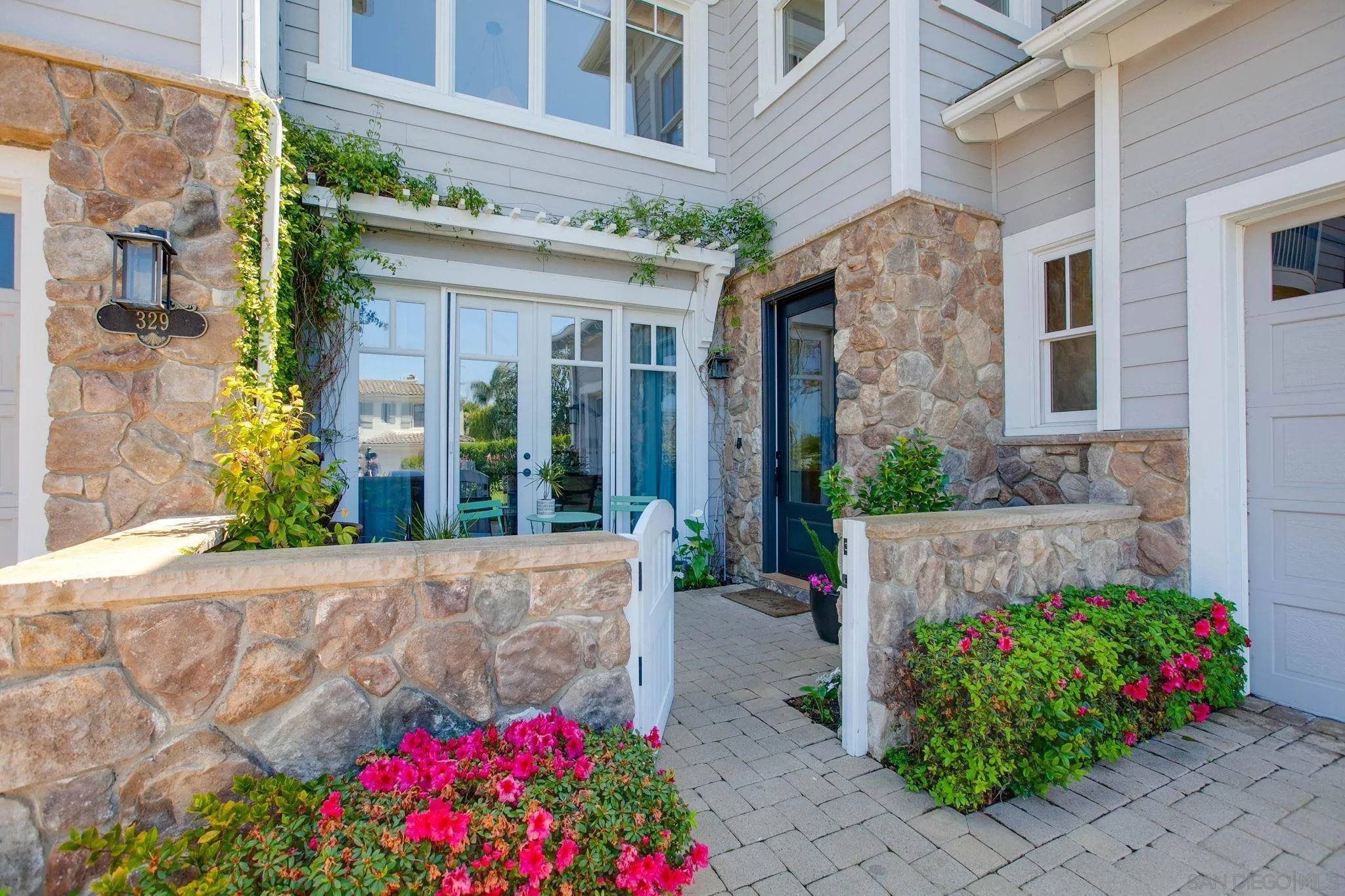 329 Chopin Way Cardiff, CA 92007 - Photo 2 of 47 a view of a house with potted plants