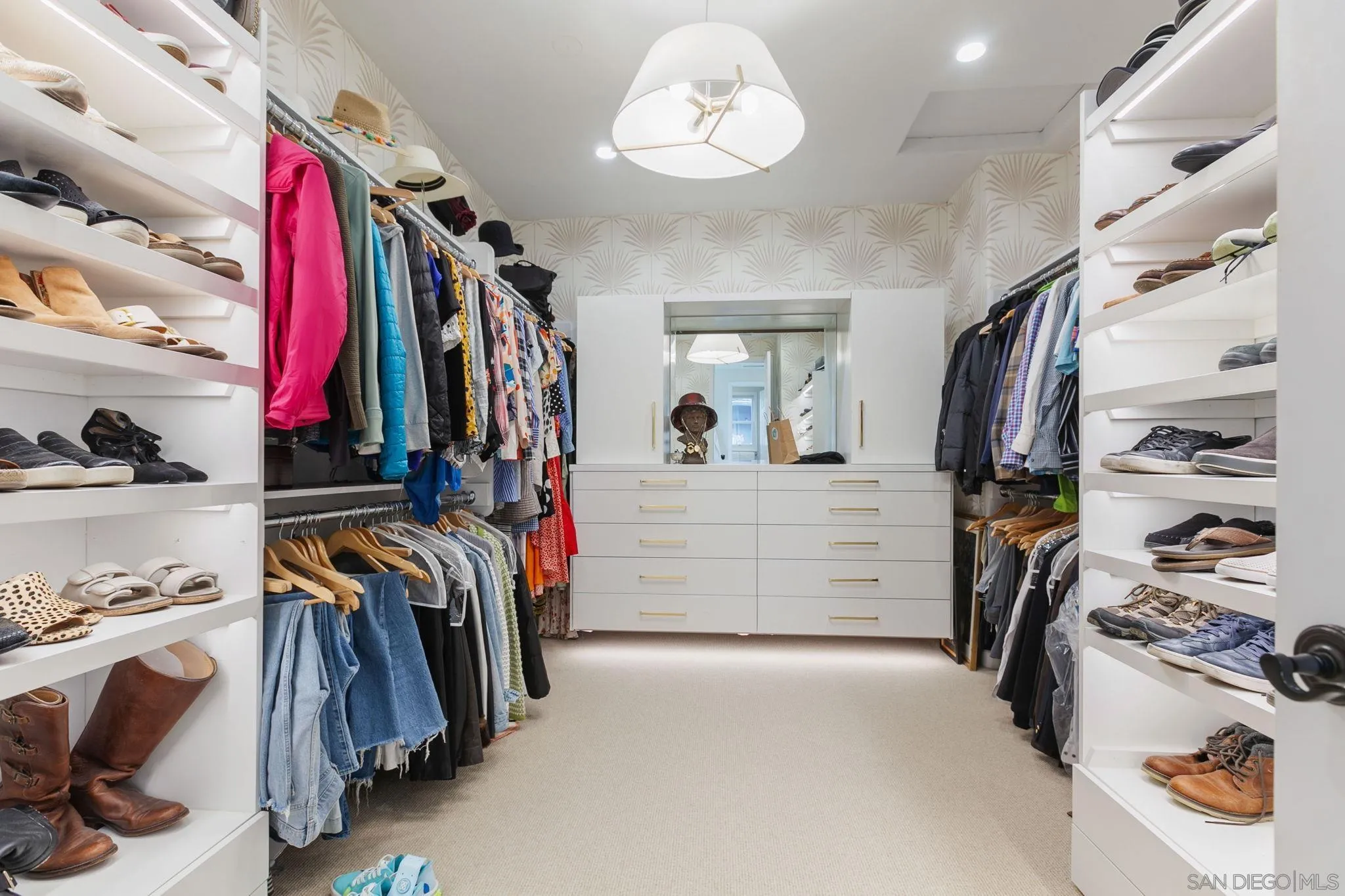 329 Chopin Way Cardiff, CA 92007 - Photo 31 of 47 a view of walk in closet with clothes and shoes