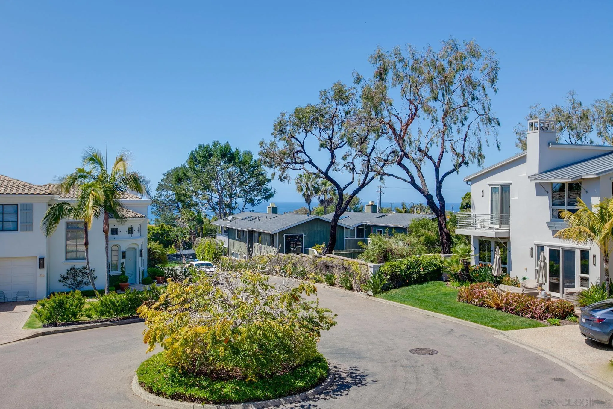 329 Chopin Way Cardiff, CA 92007 - Photo 34 of 47 a front view of a house with a yard and outdoor seating