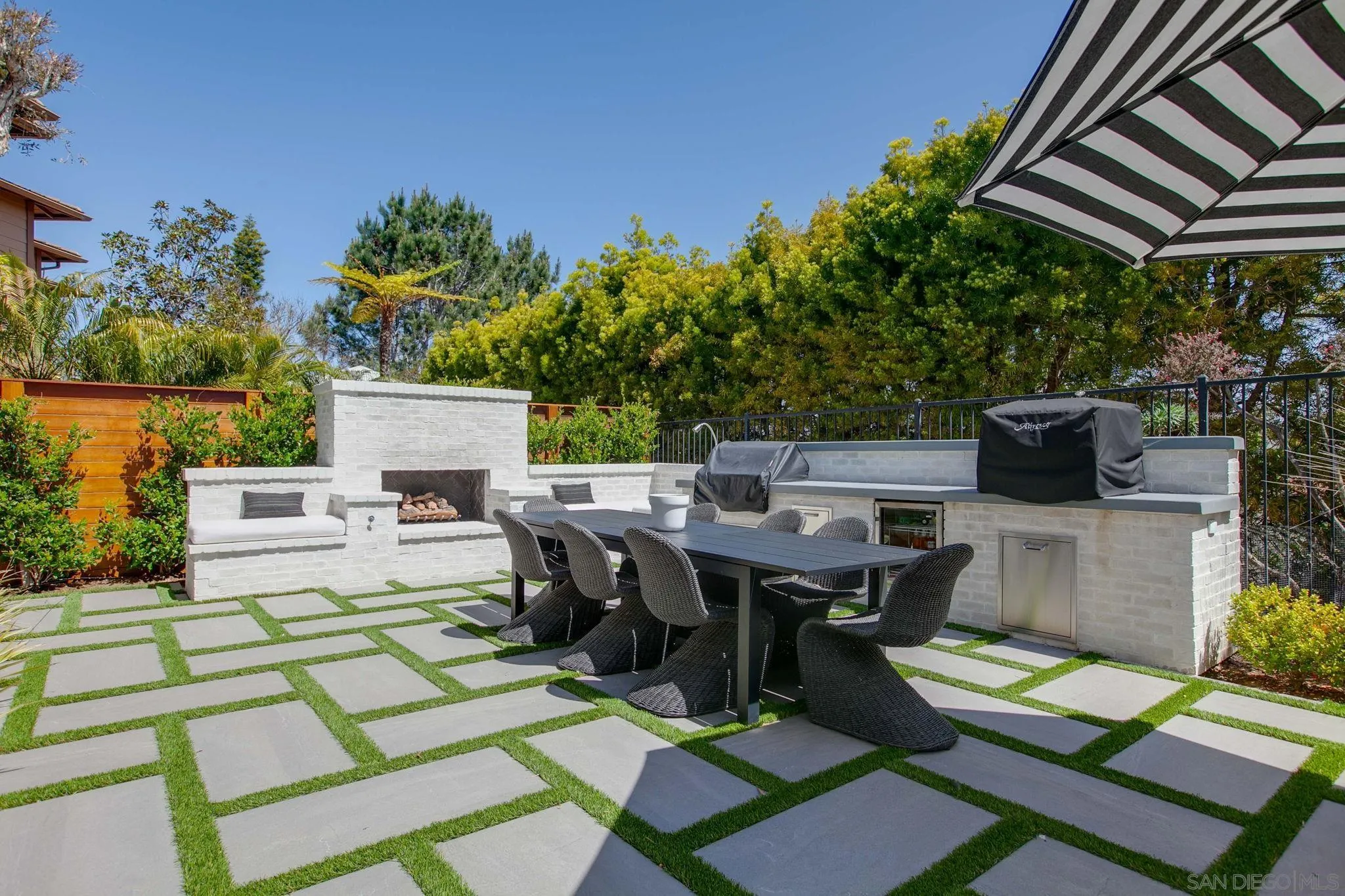 329 Chopin Way Cardiff, CA 92007 - Photo 36 of 47 a view of a patio with table and chairs and potted plants