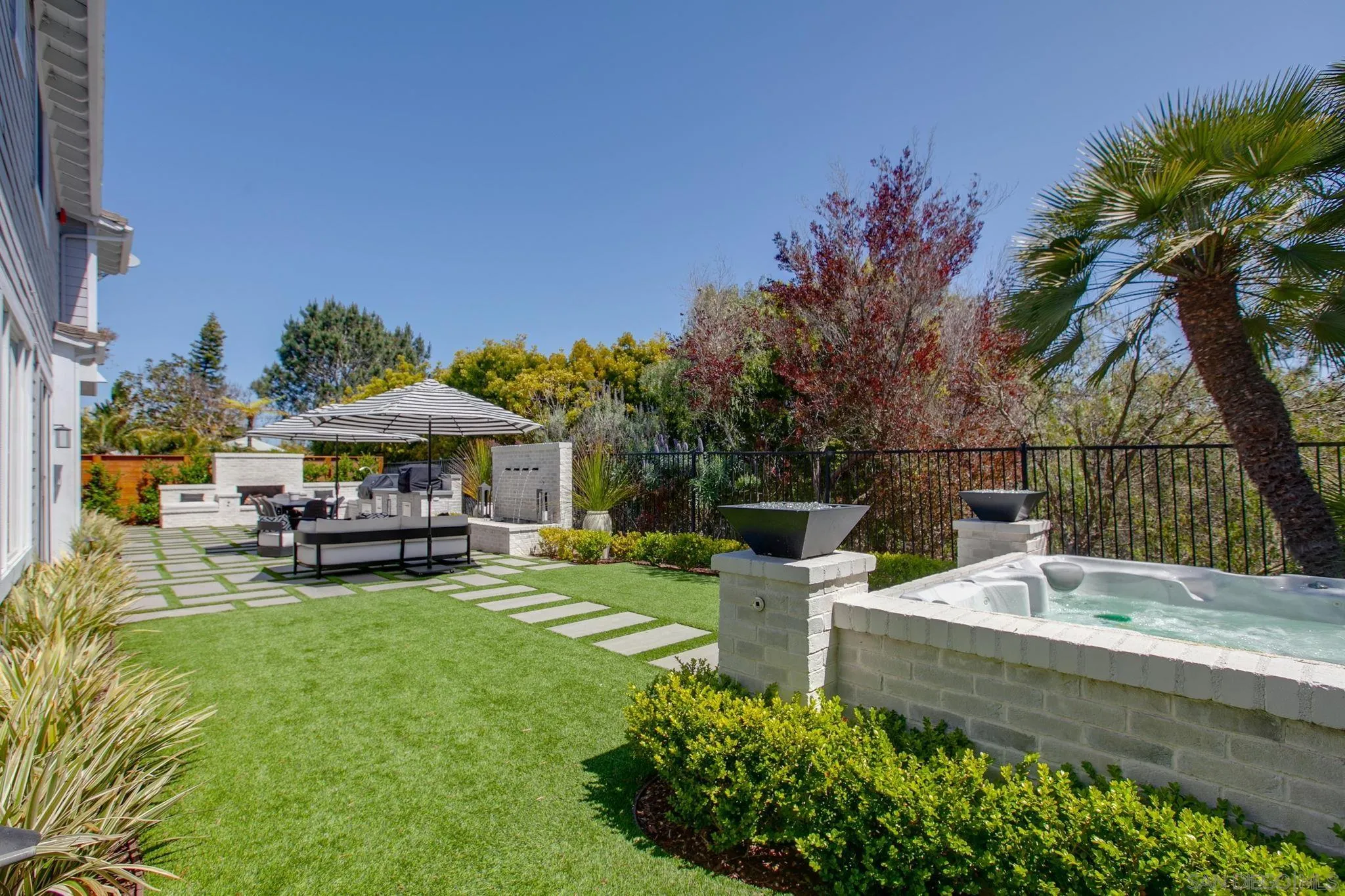 329 Chopin Way Cardiff, CA 92007 - Photo 40 of 47 a view of a house with a yard porch and sitting area