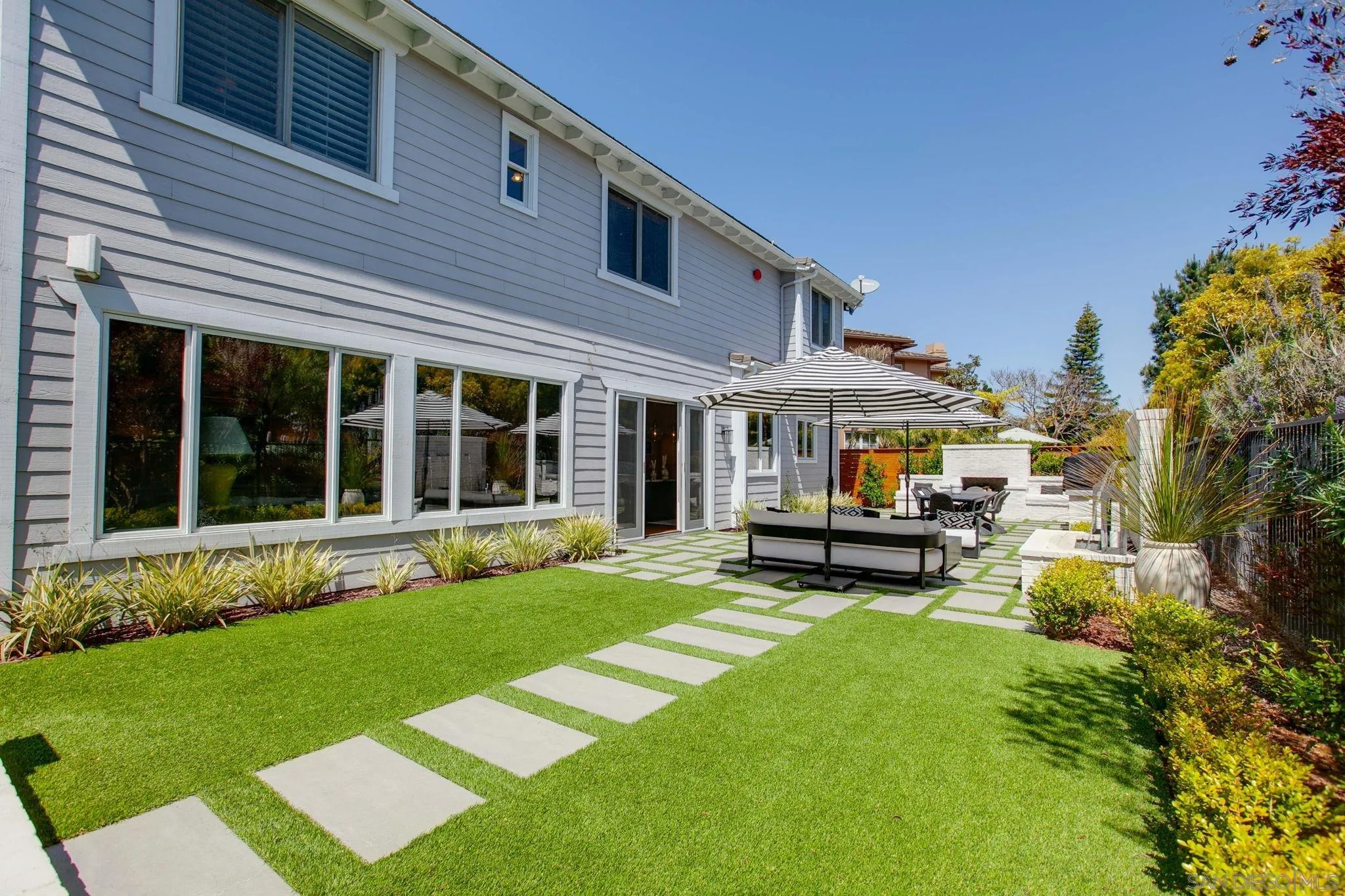329 Chopin Way Cardiff, CA 92007 - Photo 41 of 47 a view of a house with a yard and sitting area