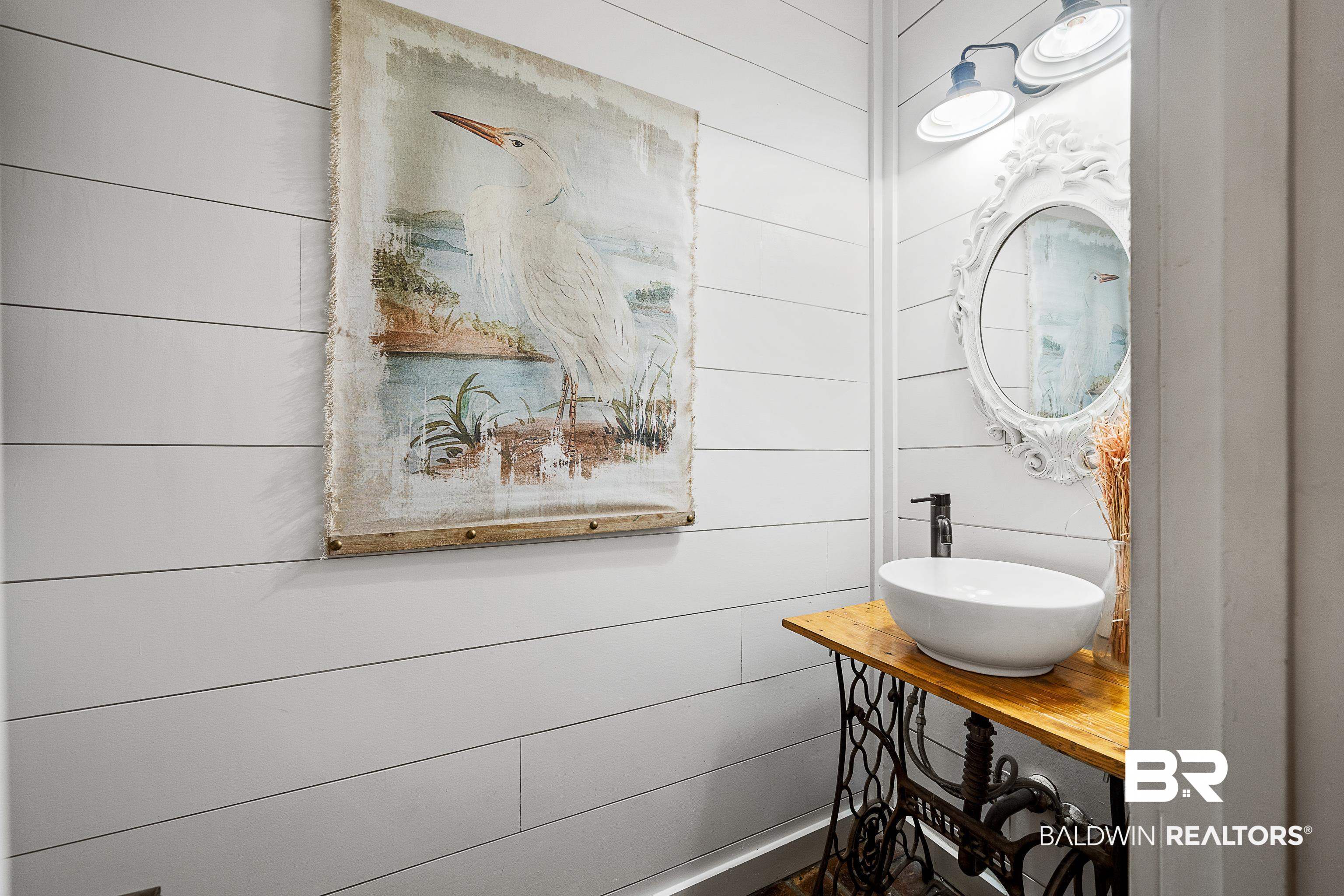 619 Ridgewood Drive Daphne, AL 36526 - Photo 17 of 47 Half bath with wooden walls and vanity