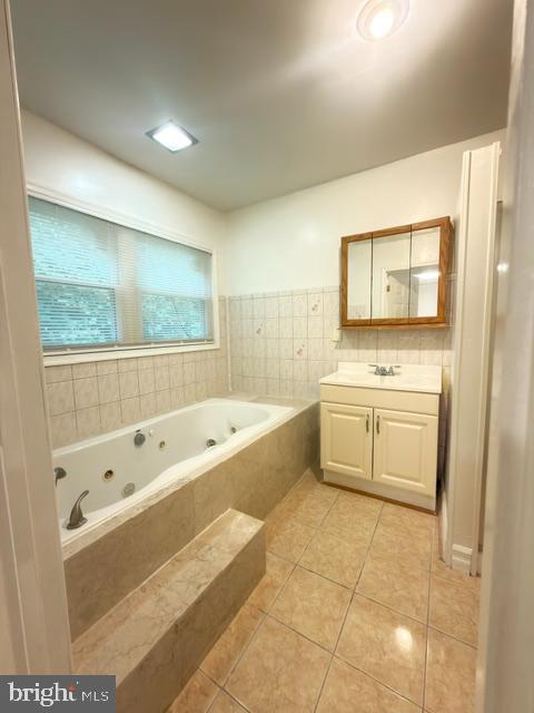 7135 Oak Ridge Road Falls Church, VA 22042 - Photo 36 of 41 a bathroom with a bathtub a sink and a shower