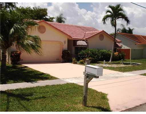7391 Texas Trail Boca Raton, FL 33487 - Photo 1 of 16 a house view with a garden space