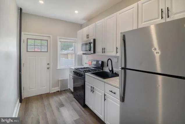a white refrigerator freezer sitting inside of a kitchen