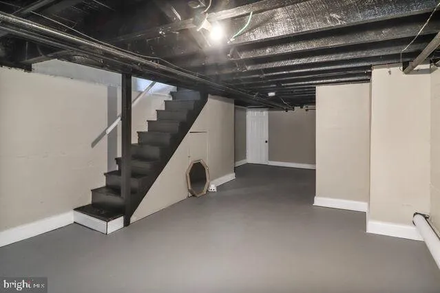 a view of an empty room with stairs