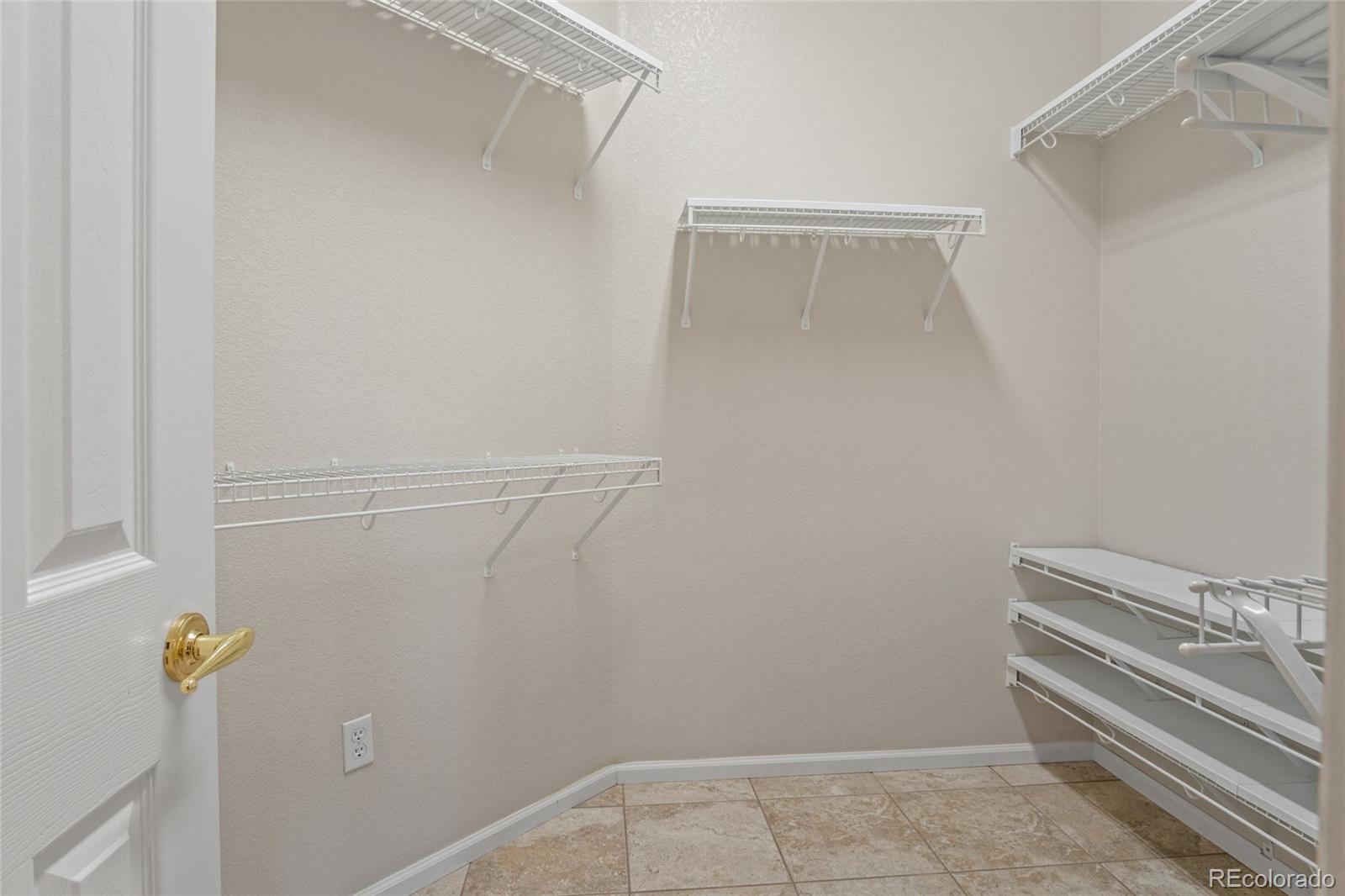 20800 Omaha Avenue Parker, CO 80138 - Photo 19 of 38 a view of storage and utility room with racks on the wall