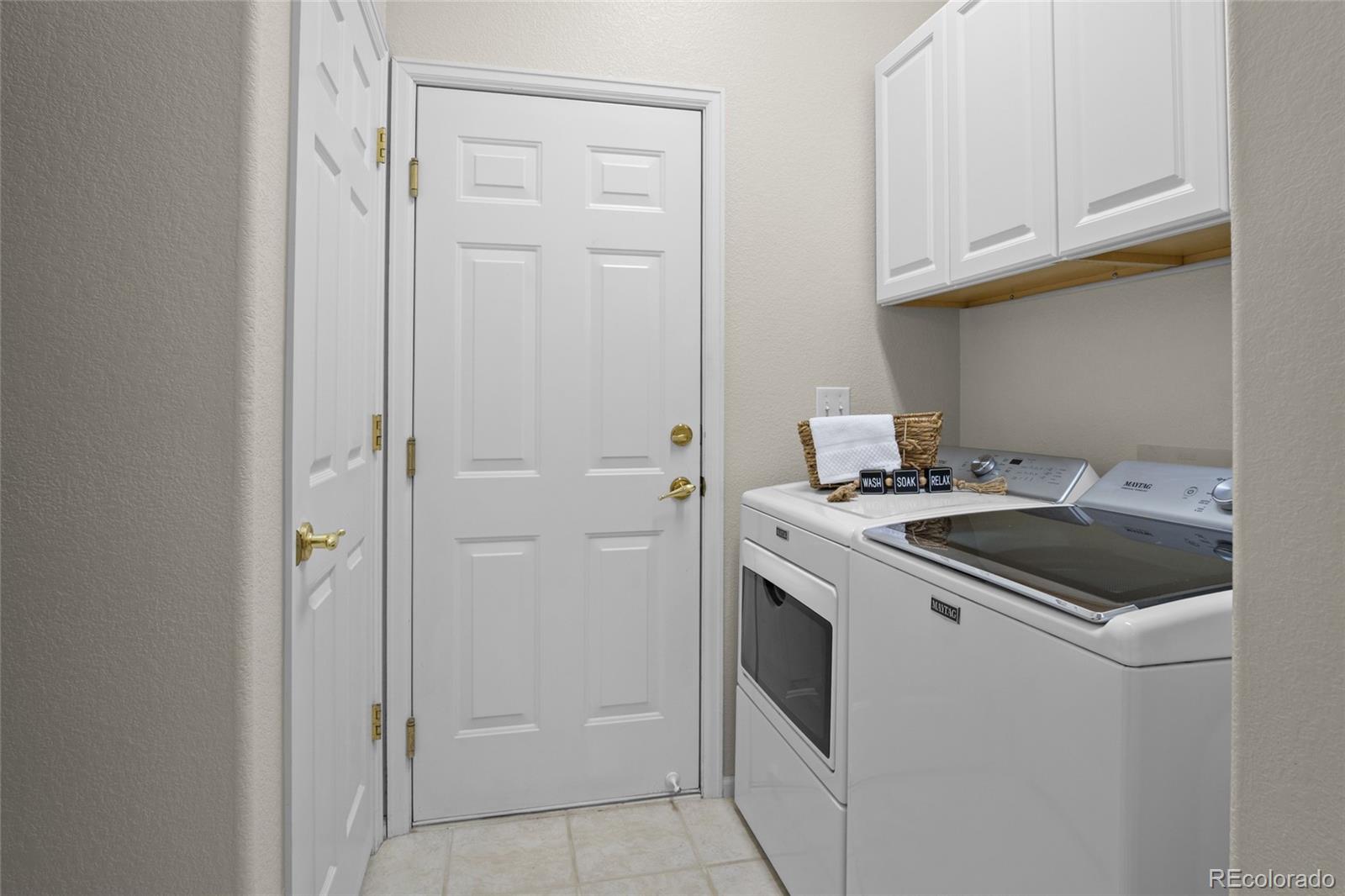 20800 Omaha Avenue Parker, CO 80138 - Photo 23 of 38 a kitchen with a stove and a refrigerator