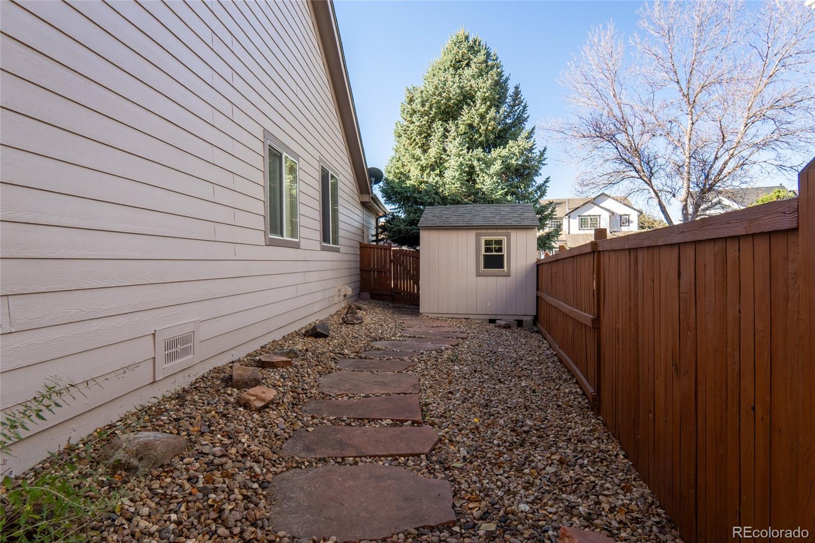 20800 Omaha Avenue Parker, CO 80138 - Photo 29 of 38 a view of a backyard with a large tree