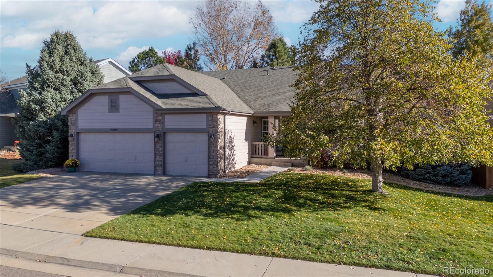 20800 Omaha Avenue Parker, CO 80138 - Photo 37 of 38 a front view of a house with a yard