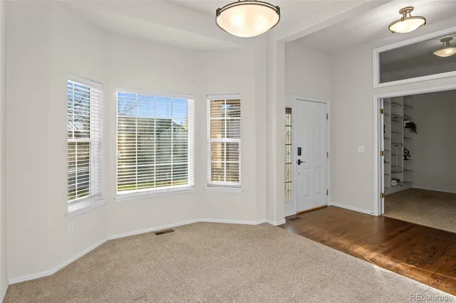 an empty room with windows