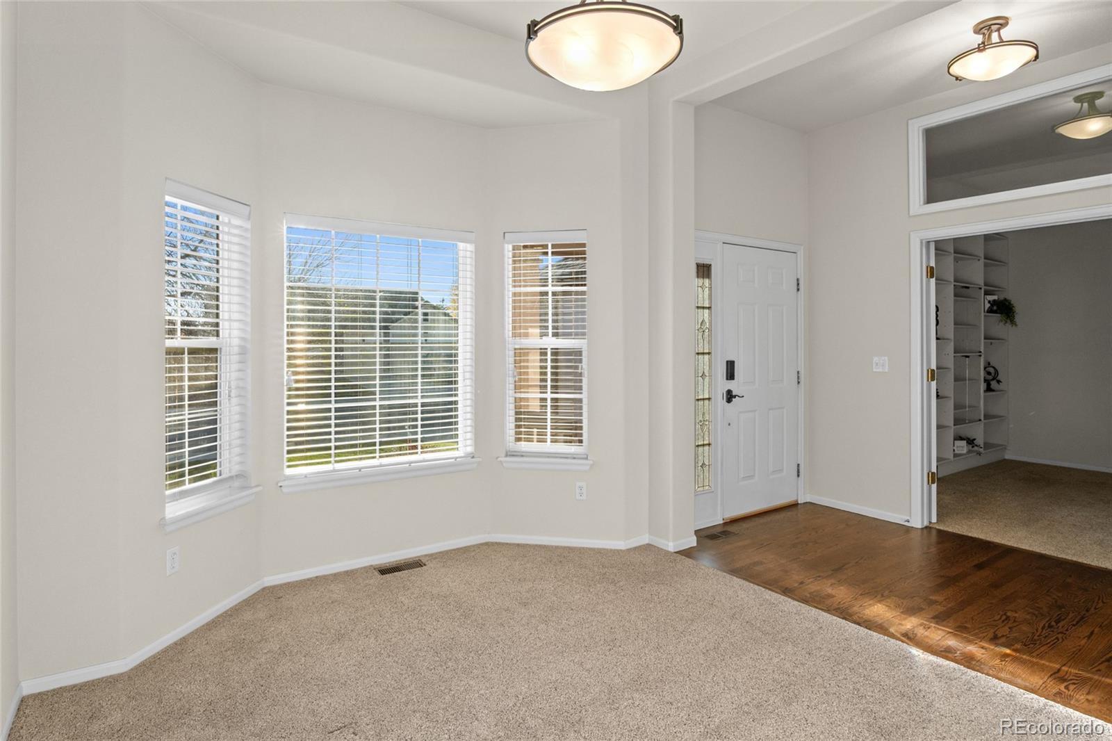 20800 Omaha Avenue Parker, CO 80138 - Photo 5 of 38 an empty room with windows