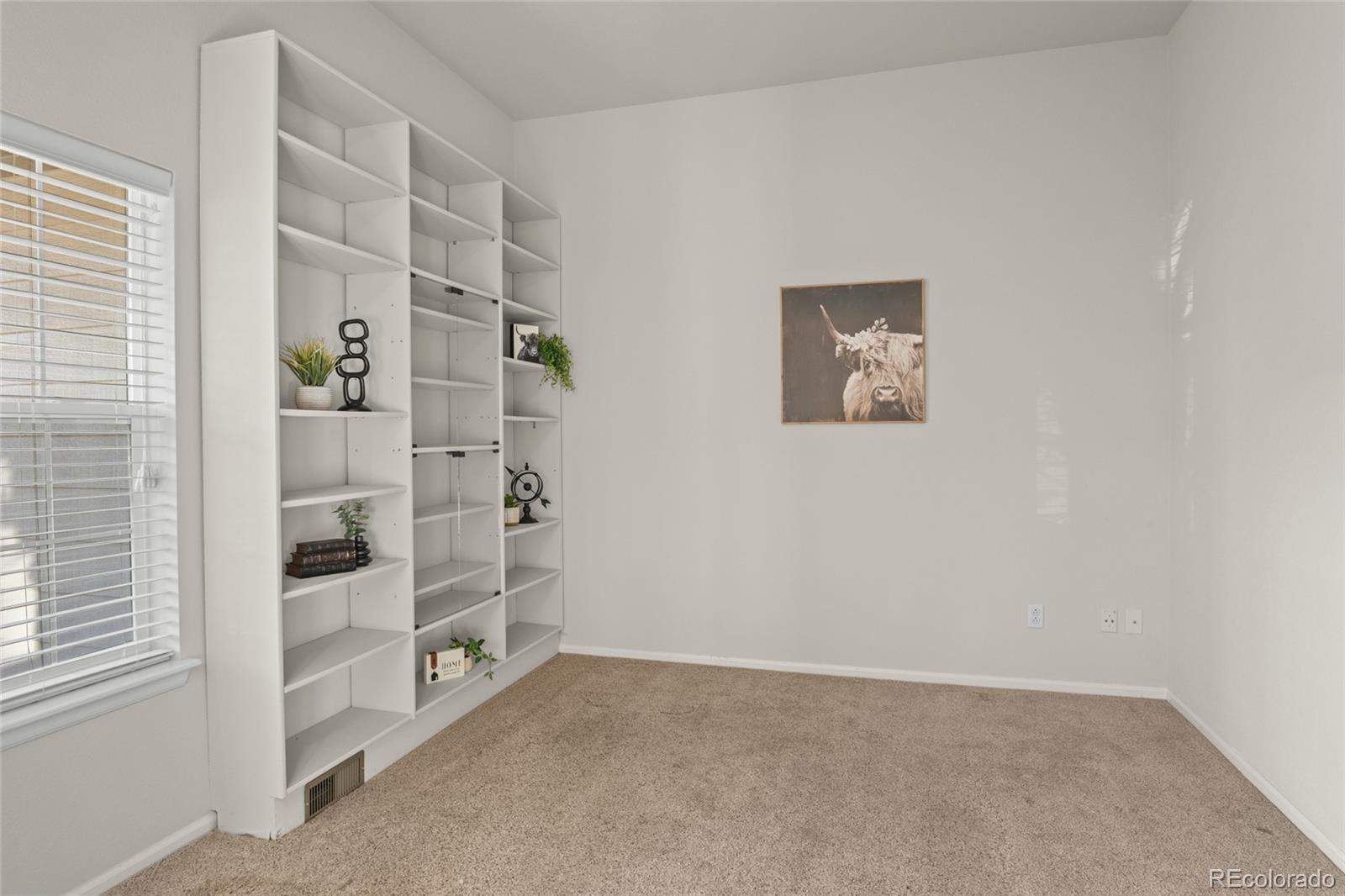 20800 Omaha Avenue Parker, CO 80138 - Photo 6 of 38 an empty room with windows
