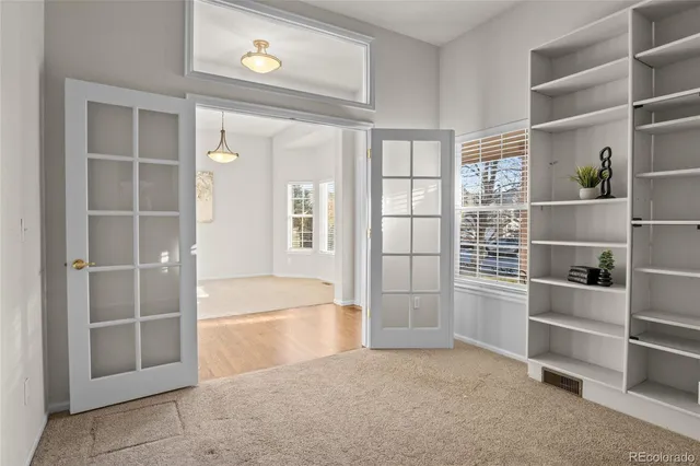 a view of an empty room with a empty shelves