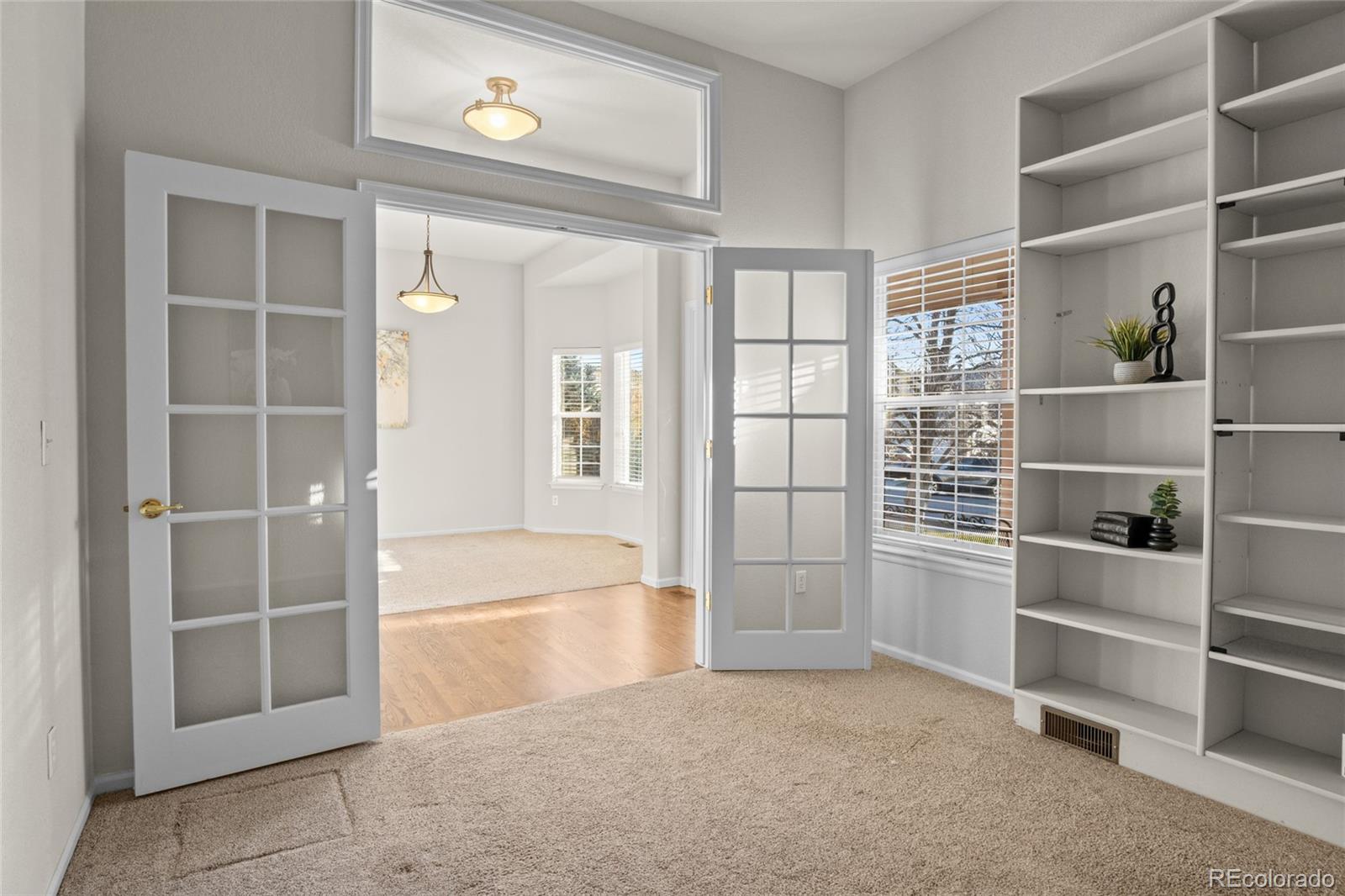 20800 Omaha Avenue Parker, CO 80138 - Photo 7 of 38 a view of an empty room with a empty shelves