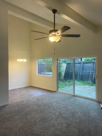 a view of empty room with fan