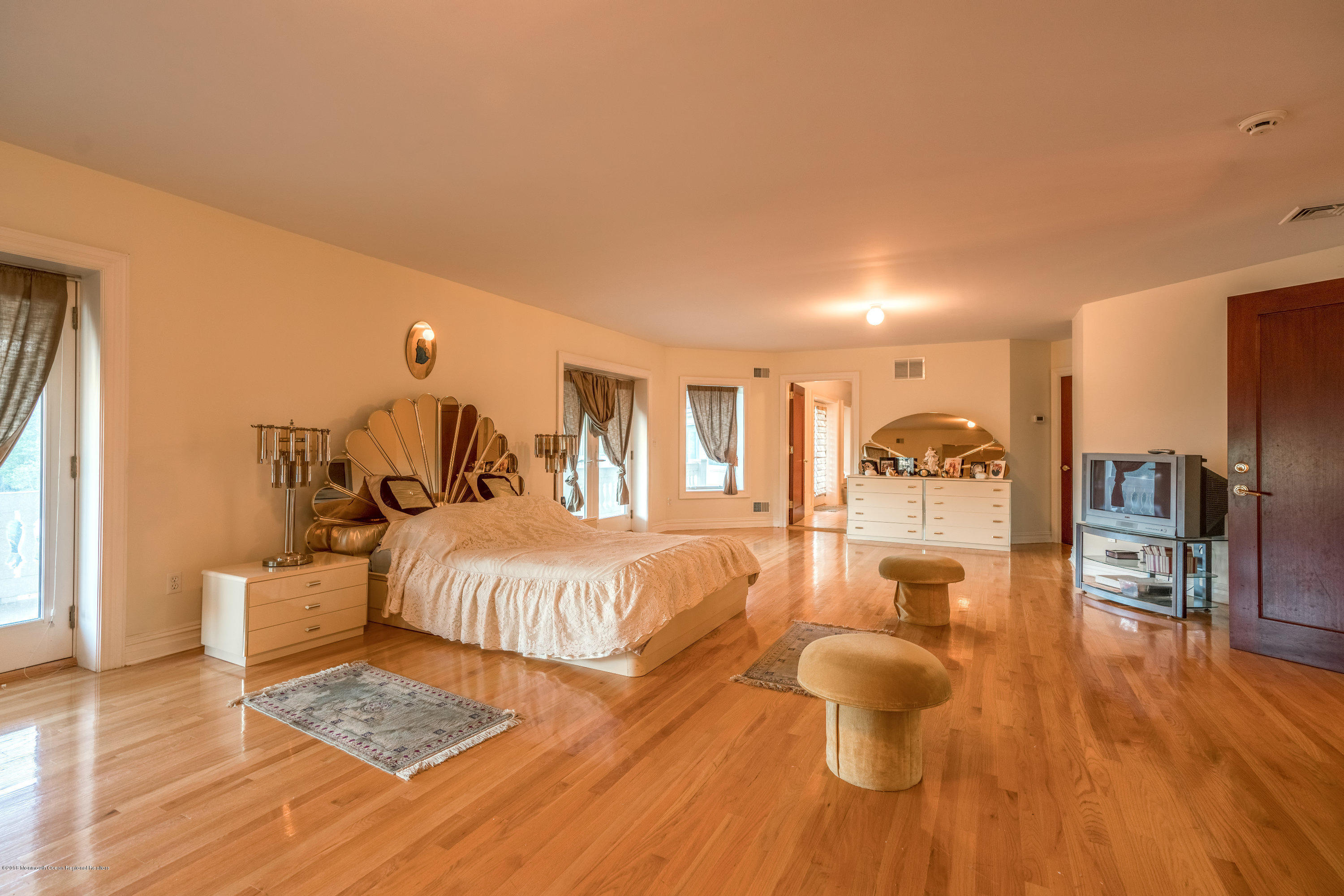 93 Five Points Road Freehold, NJ 07728 - Photo 20 of 48 a spacious bedroom with a bed and wooden floor