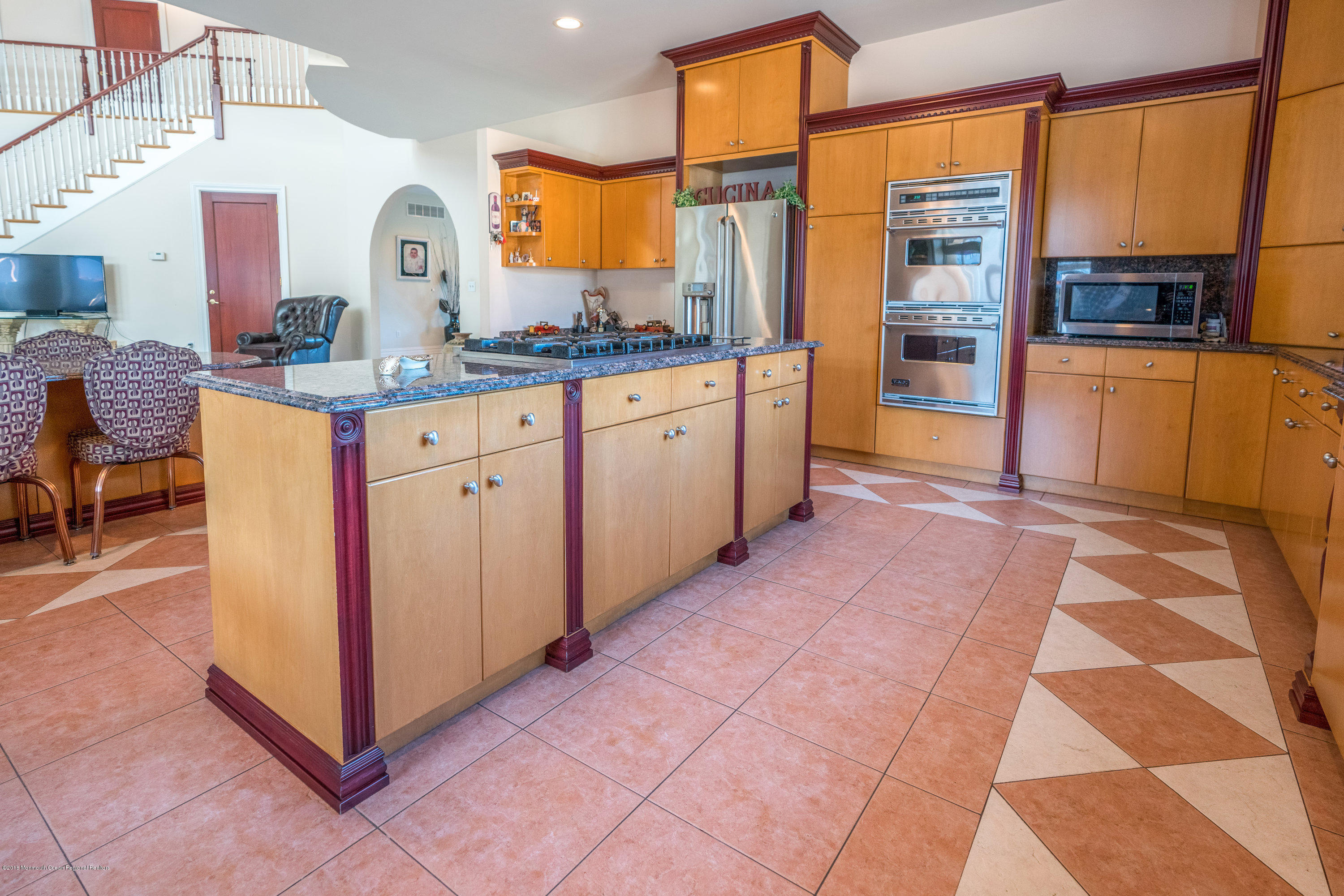 93 Five Points Road Freehold, NJ 07728 - Photo 38 of 48 a large kitchen with stainless steel appliances kitchen island granite countertop a refrigerator and a stove