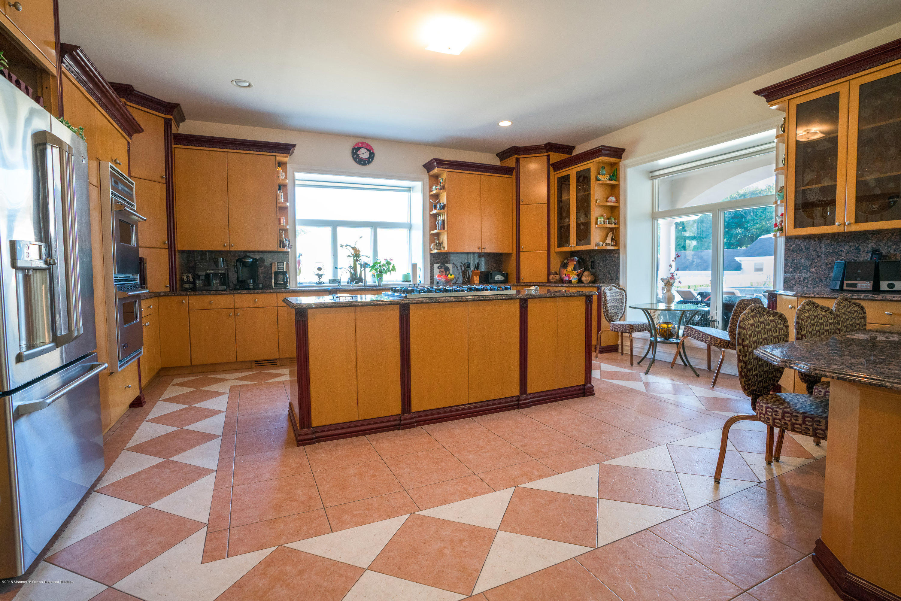 93 Five Points Road Freehold, NJ 07728 - Photo 39 of 48 a living room with stainless steel appliances granite countertop furniture a rug and a large window