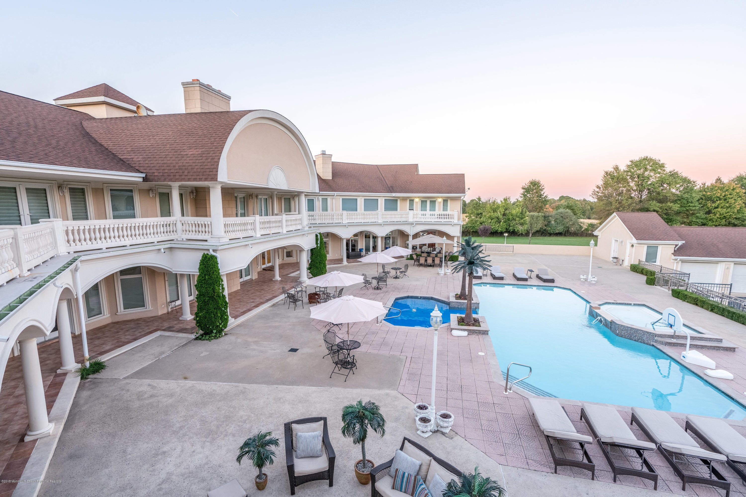 93 Five Points Road Freehold, NJ 07728 - Photo 41 of 48 a view of a house with pool lawn chairs and a barbeque