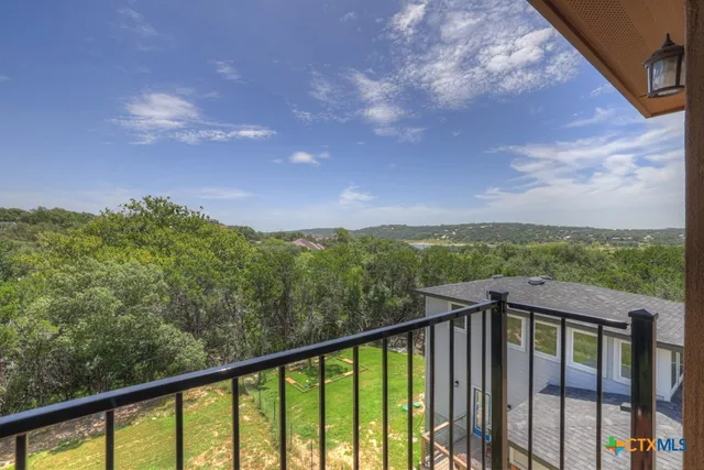a view of a balcony with an outdoor space