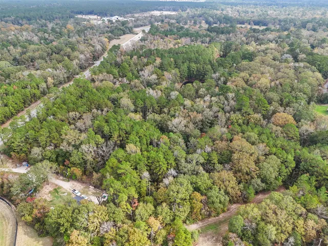 a view of a city and green field