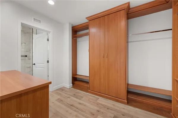 a view of room with wooden floor and window
