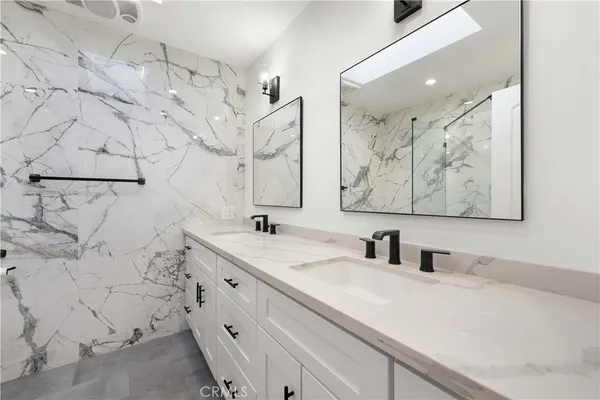 a bathroom with a bathtub and a shower