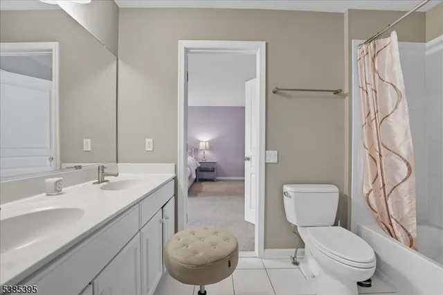 a bathroom with a toilet sink and shower