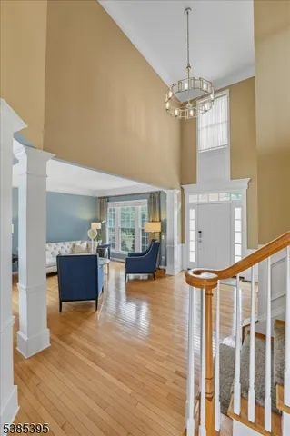 a view of living room with furniture and a chandelier