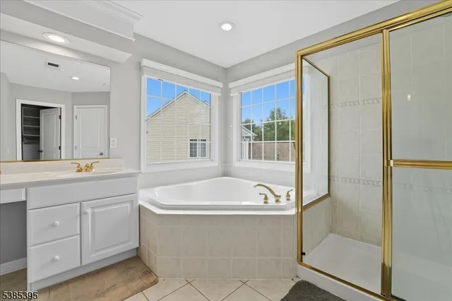 a bathroom with a bathtub and a sink