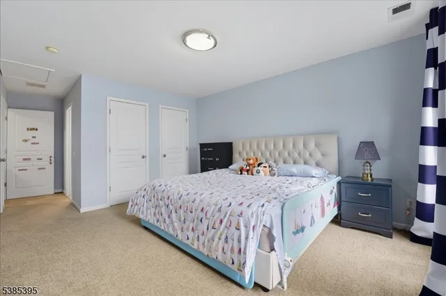 a bedroom with a bed and dresser