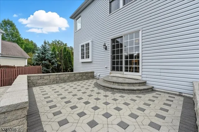 a view of a backyard with a white umbrella