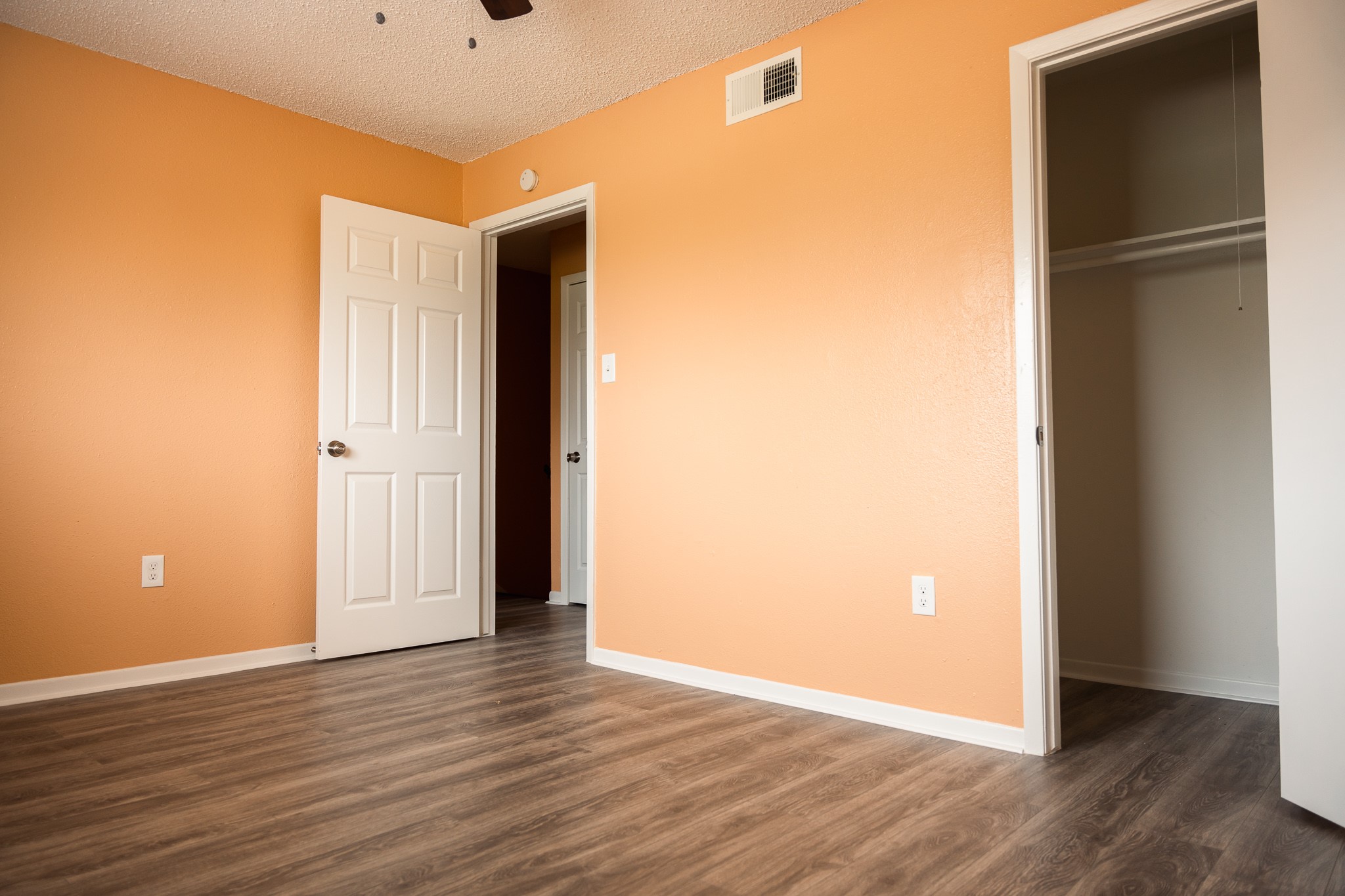 1506 Eagle Lake Road Sealy, TX 77474 - Photo 13 of 17 an empty room with wooden floor and windows