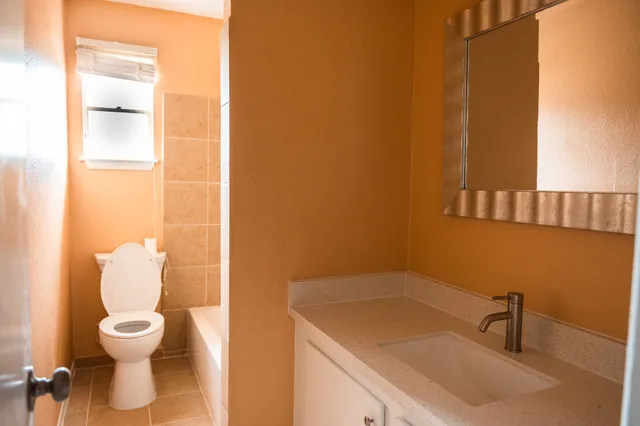 a bathroom with a sink and toilet