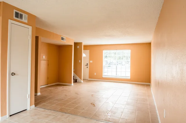 a view of an empty room and window