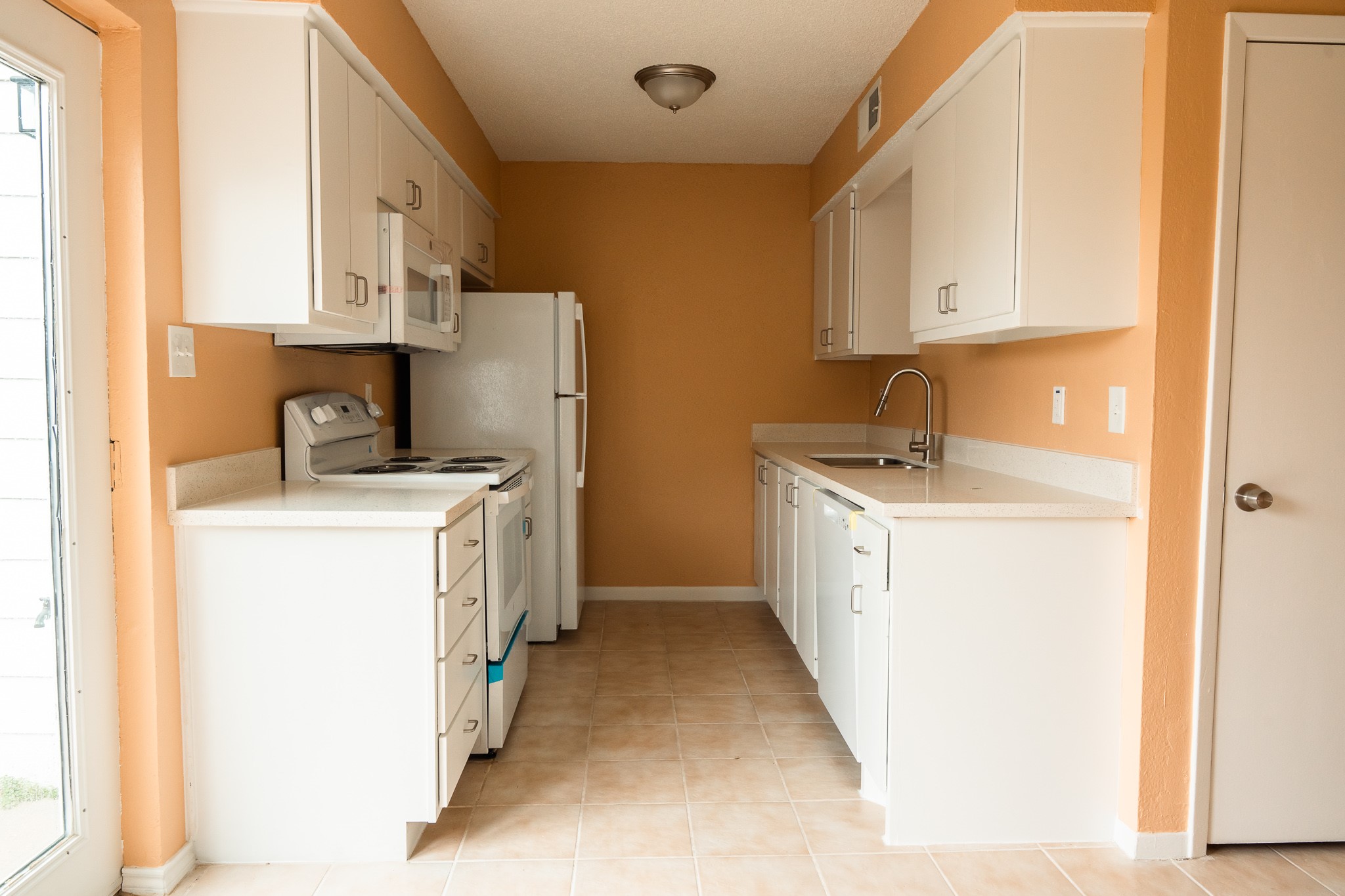 1506 Eagle Lake Road Sealy, TX 77474 - Photo 4 of 17 a utility room with cabinets washer and dryer