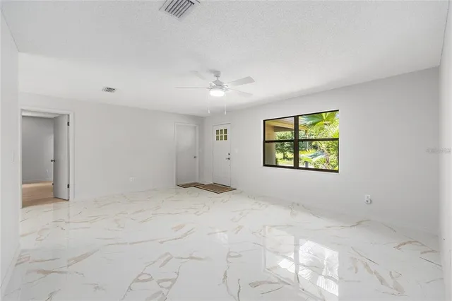 a view of an empty room with a window