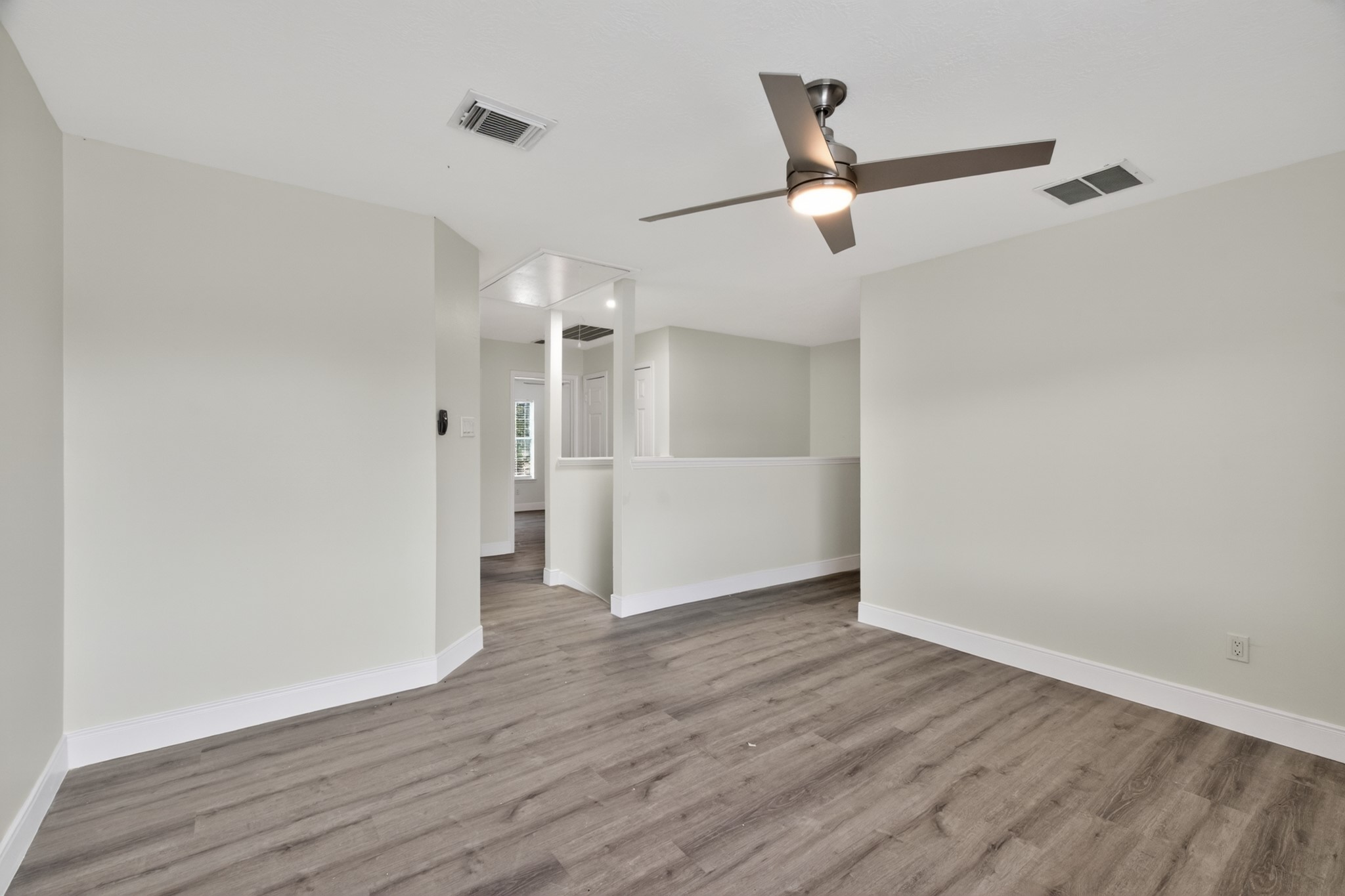 918 Ivycroft Lane Spring, TX 77373 - Photo 19 of 33 an empty room with wooden floor ceiling fan and windows