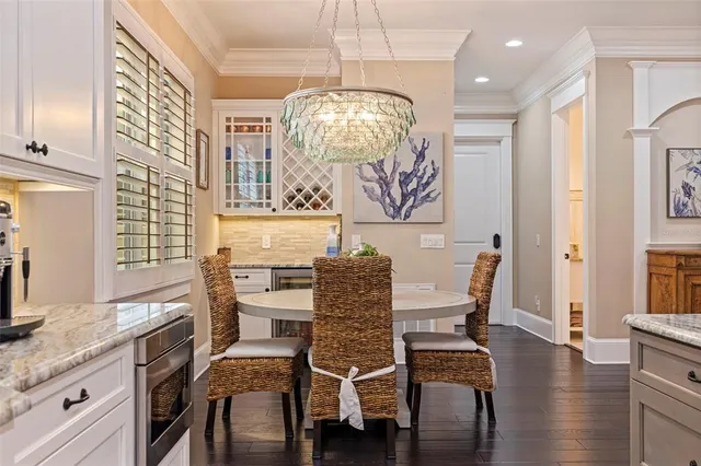 a living room with furniture and a view of kitchen