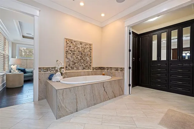 a bedroom with a bed couch and window