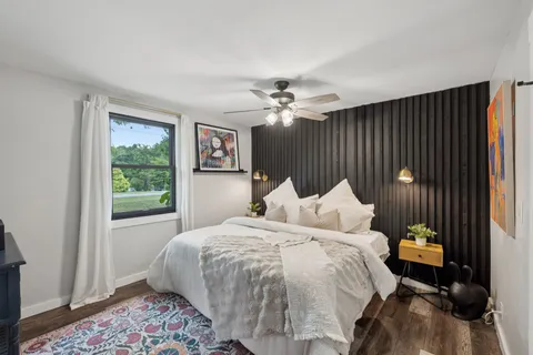 a bed room with a bed and a window