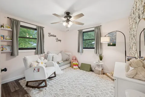a bedroom with furniture and windows