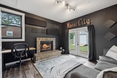 a bedroom with a bed and a fireplace