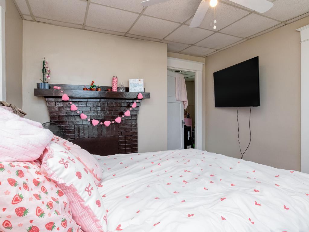 282 9th Street Ambridge, PA 15003 - Photo 11 of 21 a bedroom with a bed and a flat screen tv