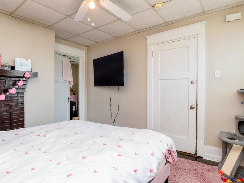 282 9th Street Ambridge, PA 15003 - Photo 13 of 21 a bedroom with a bed and a flat screen tv